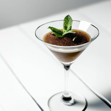 espresso granita in a martini glass with a mint garnish